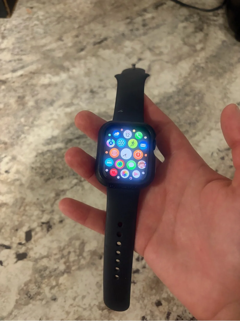 Apple Watch with Black Sport Band and otterbox Case